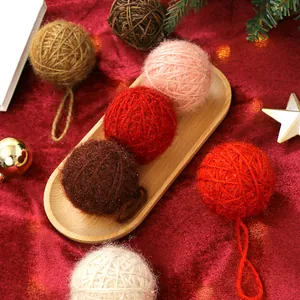 Exquisite Christmas wool yarn balls ornaments set on red velvet background