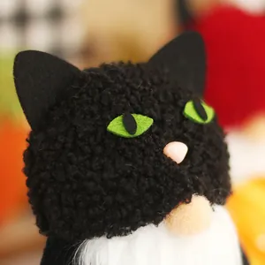 Adorable Halloween black cat gnome doll with fuzzy texture and green eyes for party decor
