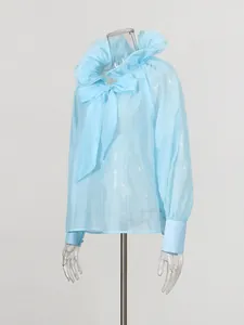 Elegant French style light blue sheer blouse featuring ruffled collar and bow tie