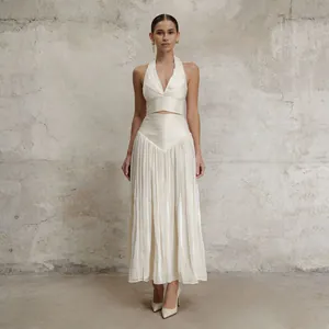 Full view of elegant cream French style halter top and pleated midi skirt two-piece set