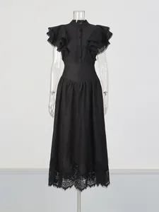 Retro black two-piece set with ruffle sleeve top and high-waisted lace hem skirt