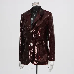Detailed view of wine red sequined blazer with sparkling texture and metallic buttons
