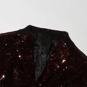 Detail shot showing the V-neck lapel and burgundy sequins of a women's blazer jacket