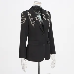 Detail showing heavy rhinestone and bead embroidery on black women's fashion blazer jacket