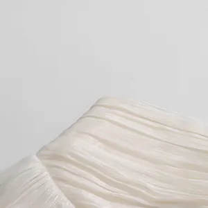 Detailed texture of white pleated fabric for elegant French style skirt set