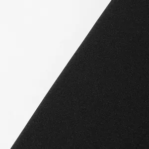 Close-up of high-quality black fabric texture for luxury heavy beaded suit jacket.