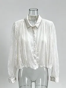 Elegant French style white lace long-sleeved shirt with pearl collar detail on mannequin