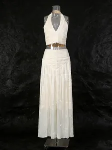 Elegant French style halter neck top and pleated maxi skirt two-piece set in cream white