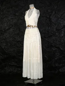 Elegant French style two-piece set with halter top and pleated maxi skirt in cream
