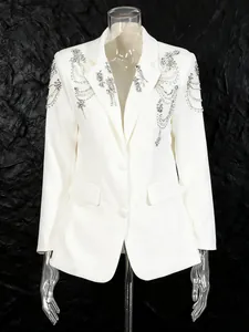 Elegant white women blazer featuring intricate beadwork and crystal accents on black background