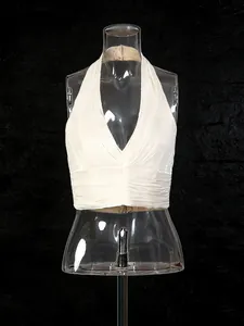 Elegant white halter neck sleeveless top with pleated detail shown on a mannequin