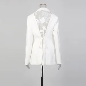 Detailed back view of white slim blazer with lace hollow-out design and elegant tie-knot