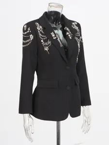 Elegant black women's blazer featuring heavy rhinestone and beaded shoulder details