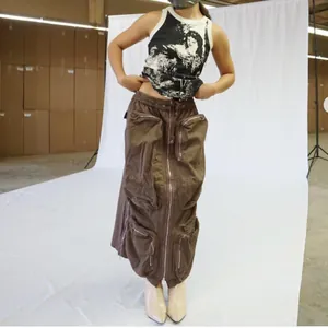Detailed view of brown high-waisted cargo skirt with multi-pocket and zipper design