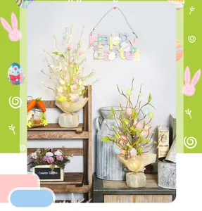 Detailed scene showing two LED glowing Easter egg trees on a rustic table setting