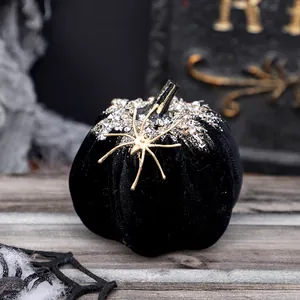 Exquisite black velvet Halloween pumpkin ornament decorated with crystals and a gold spider