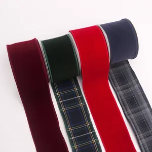 Close-up of premium velvet ribbons with plaid edges for Christmas gift wrapping decor