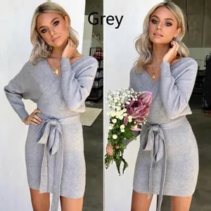 Close-up of a gray V-neck long-sleeve knit dress with a waist tie detail.