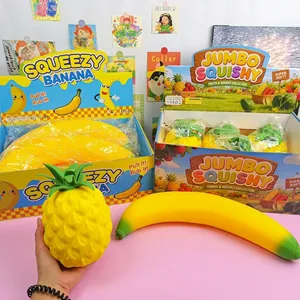 Detailed view of jumbo squishy pineapple and banana fruit toys for stress relief