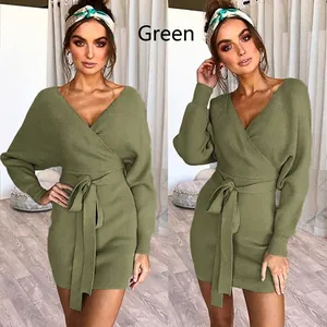 Close-up detail of the green ribbed knit wrap dress featuring a stylish waist tie