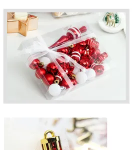 Detailed view of red and white Christmas ornament set in clear gift box packaging