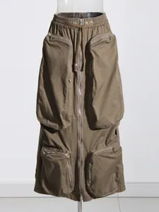 Close-up of olive green cargo midi skirt featuring multi-pockets and full zipper design