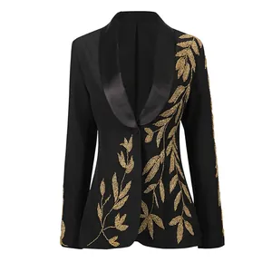 Close-up detail of the gold embroidery on a luxury slim fit black court style blazer