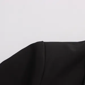 Detailed close-up showing the shoulder and collar tailoring of a black slim fit blazer