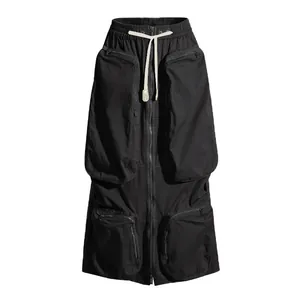 Detailed view of black heavyweight cargo midi skirt with multiple zipper pockets