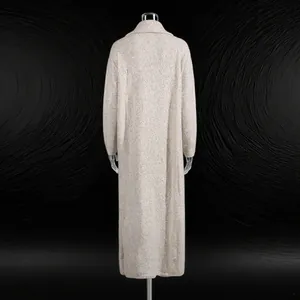 Detailed back view of a long beige knitted cardigan featuring a rich textured finish.