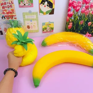 Detailed view of hand squeezing a large 45cm slow rebound pineapple squishy toy.