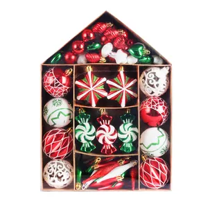 Festive Christmas ornament set in house-shaped gift box with red and green baubles.