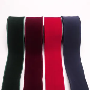 Detail view of velvet ribbons in green, burgundy, red, and navy blue for gift wrapping