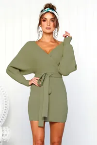 Olive green V-neck long sleeve knit bodycon dress with wrap waist tie detail on model