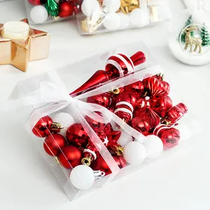 Festive 34-piece red and white Christmas ornament set in clear gift box packaging