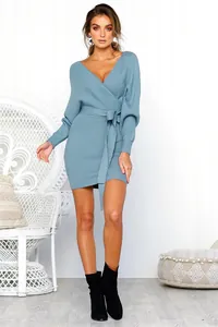 Detailed shot of a dusty blue V-neck long sleeve bodycon knit dress with tie-waist