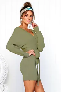Detail view of a sexy olive green V-neck ribbed knit dress with a tie-waist design.
