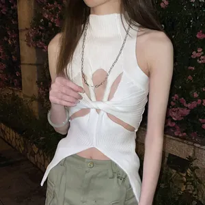 Detail view of white ribbed knit top featuring high neck and front cutout twist design