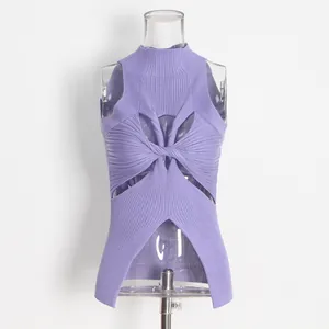Close-up of purple ribbed knit top with turtleneck and unique twist cutout design