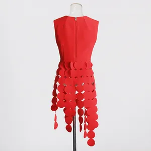 Back view of a red sleeveless vest featuring a unique circular patch fringe design
