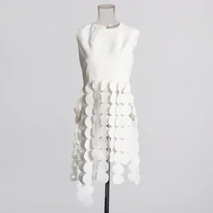White sleeveless top for women featuring a unique cascading round flake sequin design detail