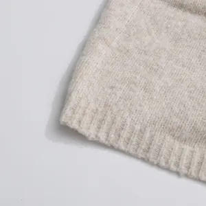 Detailed close-up view showing the soft ribbed knit fabric texture in beige melange finish
