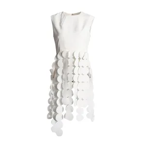 Minimalist white sleeveless top with a unique laser-cut circular scale fringe design