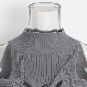 Detailed close-up showing the ribbed stand collar and knit texture of the grey vest.