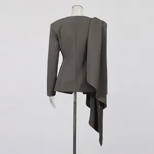 Detailed back view of a grey slim-fit blazer featuring a long irregular drape decoration