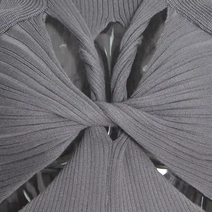 Close-up detail of grey ribbed knit top featuring a twisted knot and stylish cutout design