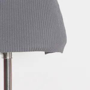 Close-up detail showing the grey ribbed knit texture and precise hemline of the tank top.