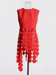 Red sleeveless top with unique circle fringe design on mannequin torso