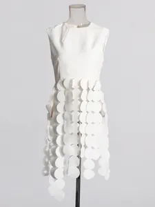Minimalist white sleeveless top for women featuring unique circular scale fringe design.