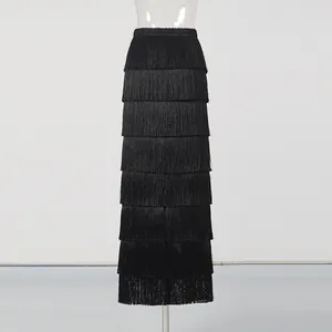 Detailed view of black tiered fringe high waist maxi skirt with elegant flowing layers